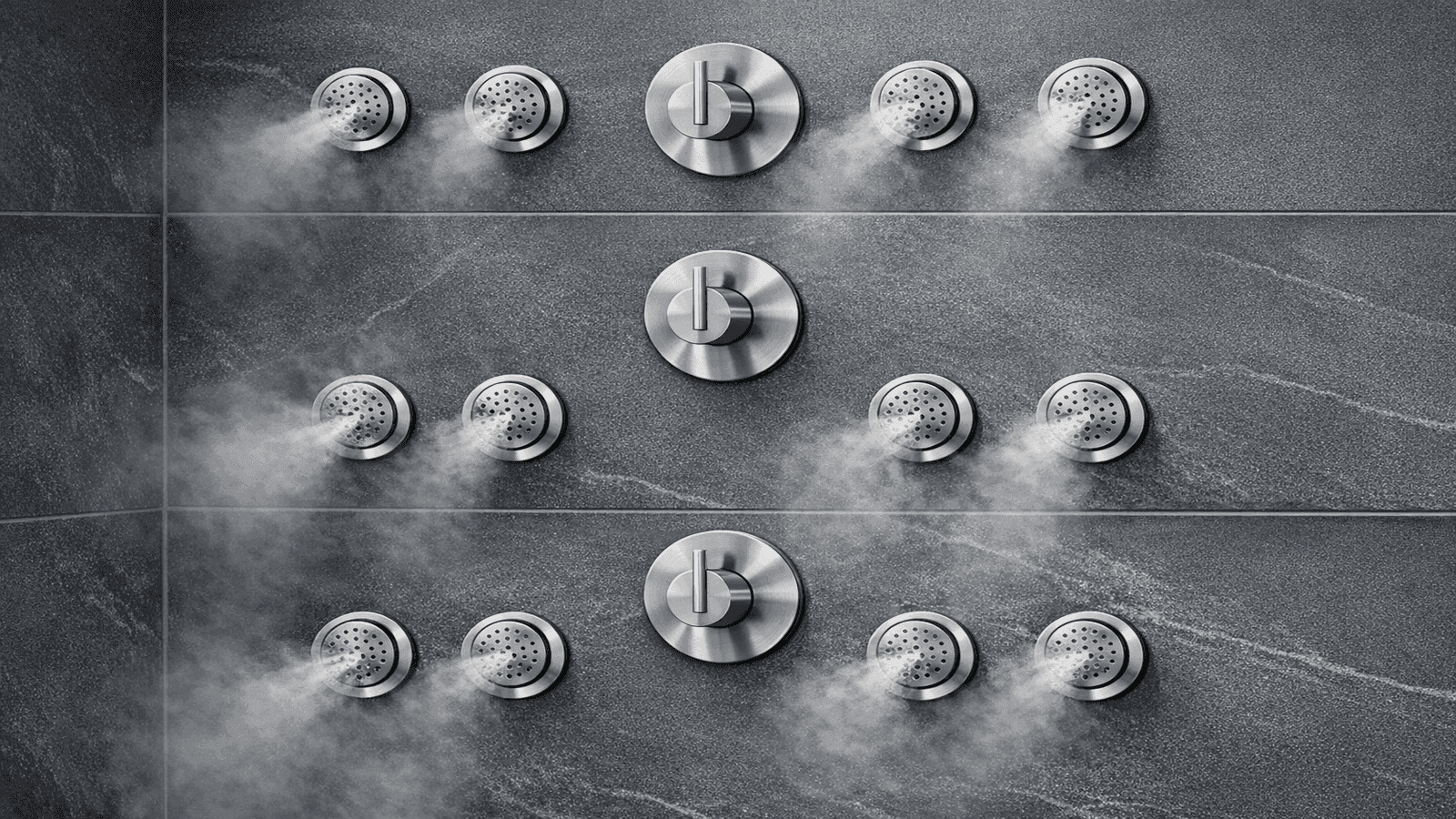 Wall-mounted body jets at three heights in a marble tile shower showing lumbar, back, and shoulder placement